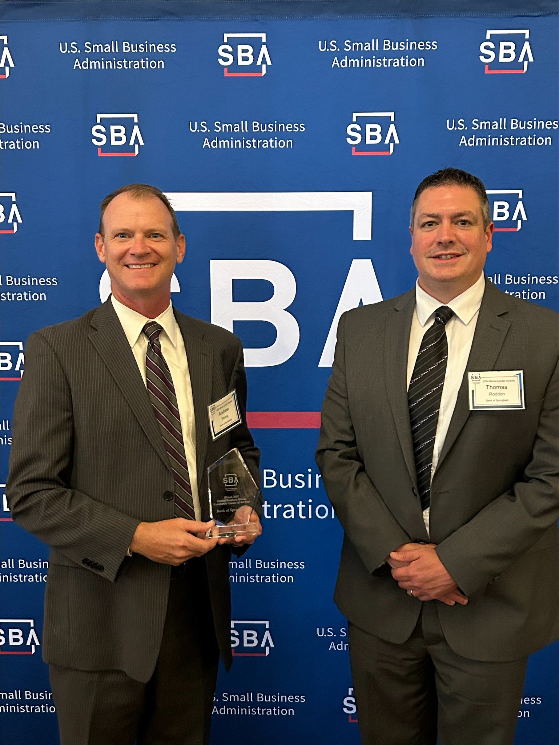 Andrew Young and Tom Rodden holding the 2023 Small Business Administration (SBA) Central / Southern Illinois Community Lender of the Year Award